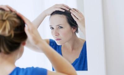 Woman looking into the mirror