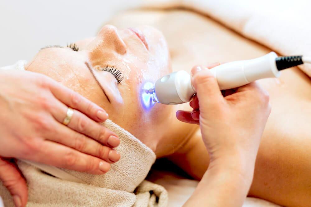 Woman undergoing laser and light skin therapy