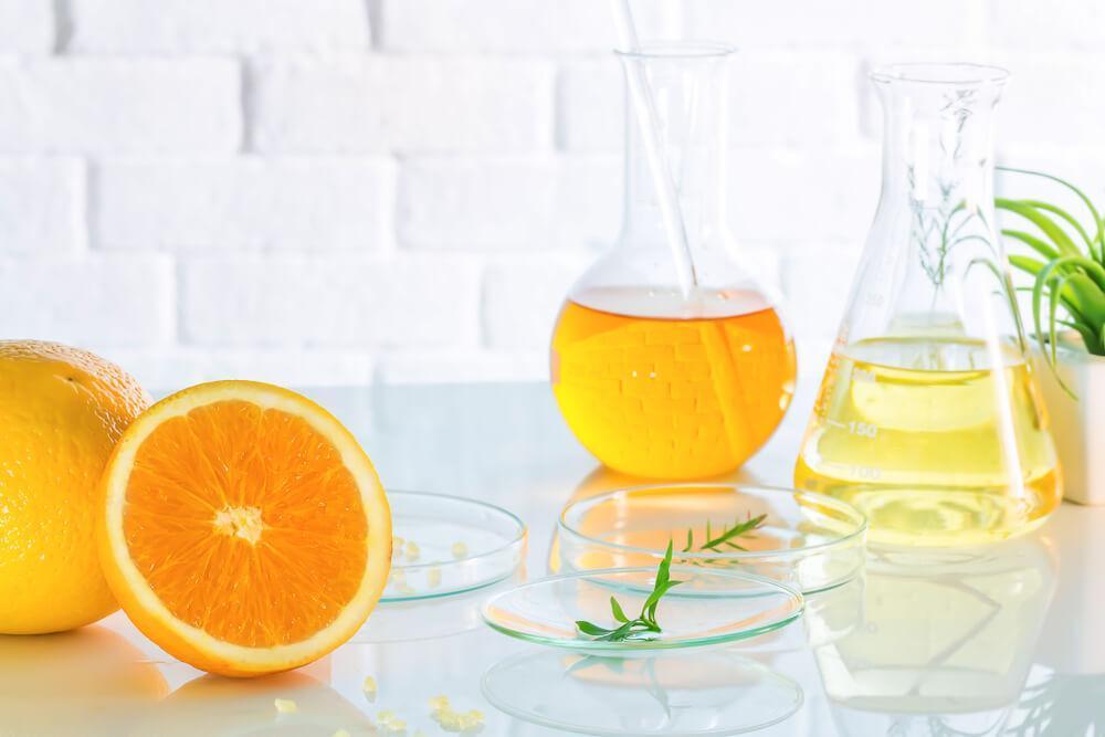 Citrus fruits and liquid in lab