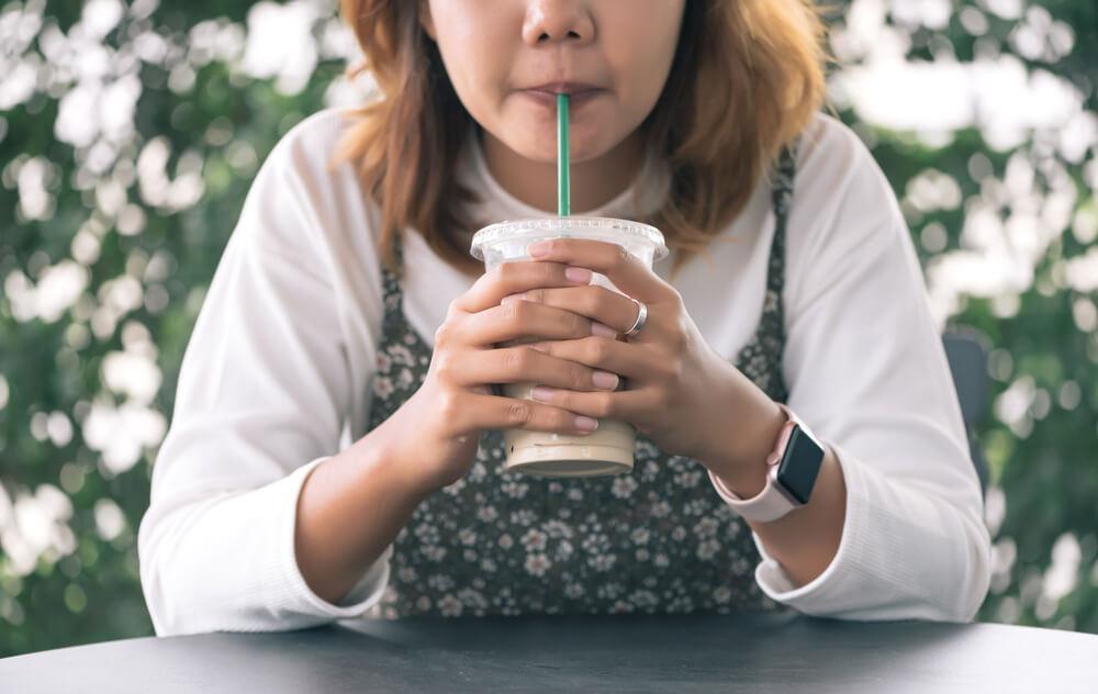 Woman drinking through straw - what causes wrinkles