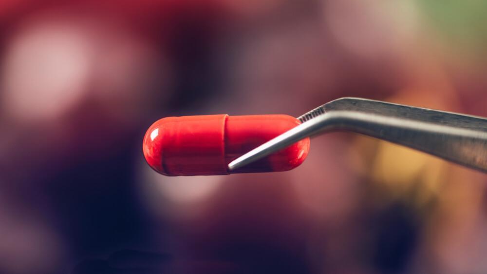 Red resveratrol supplement pill