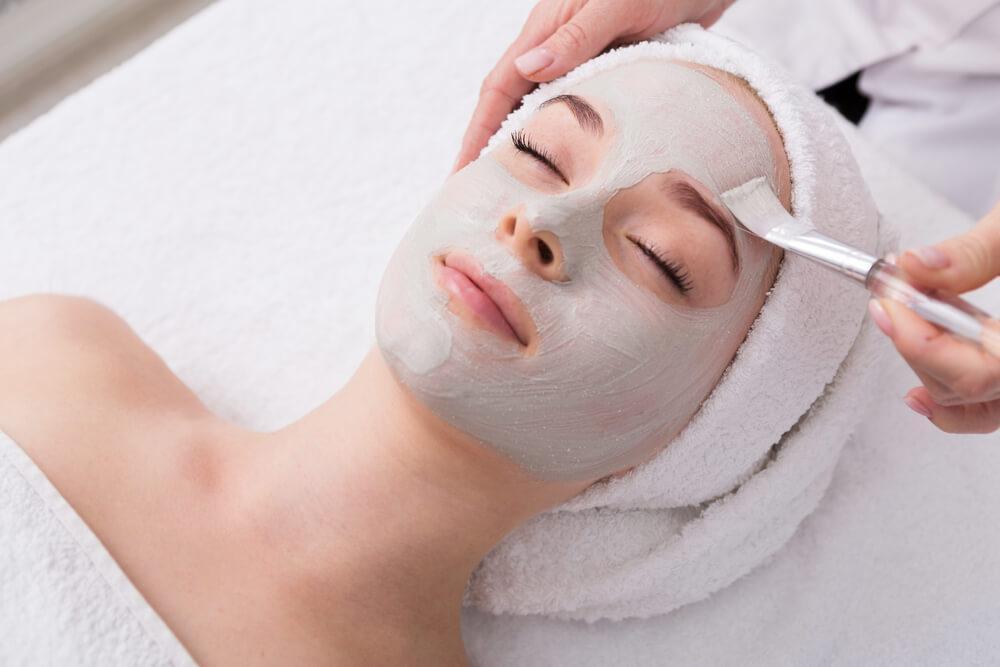 Face mask on woman's face at spa