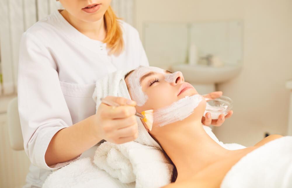 Woman having facial at spa