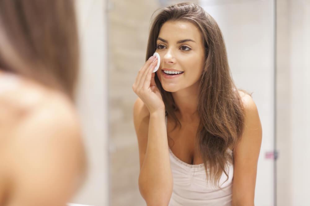 Woman removing makeup